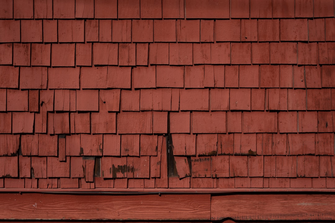 Roof showing water damage and deterioration requiring professional repair